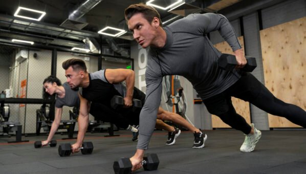 people-working-out-indoors-together-with-dumbbells